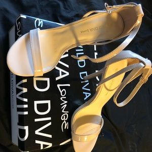 Nude open toed heels.